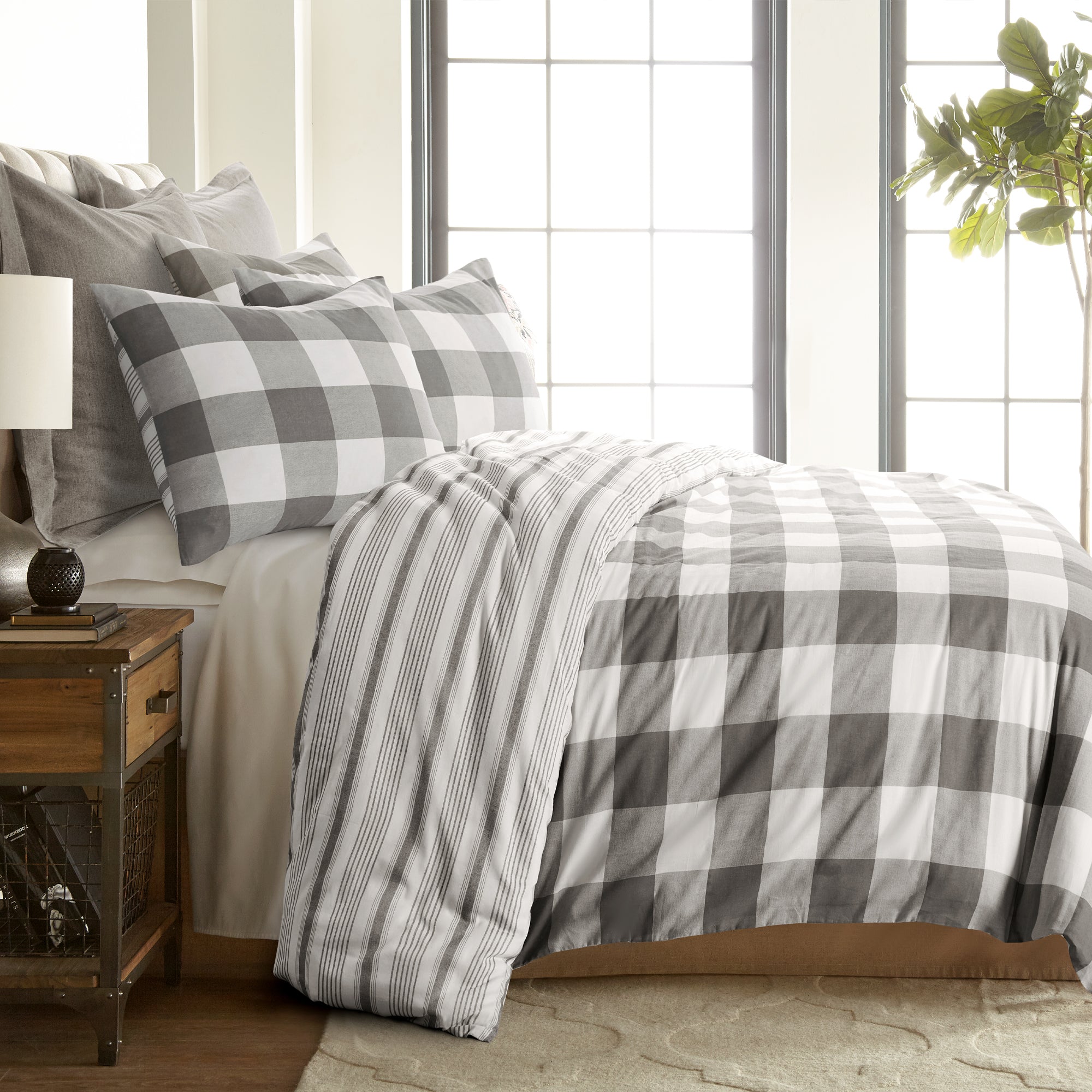Camden Comforter Set featuring a reversible buffalo check and stripe design, creating a cozy bedroom aesthetic.