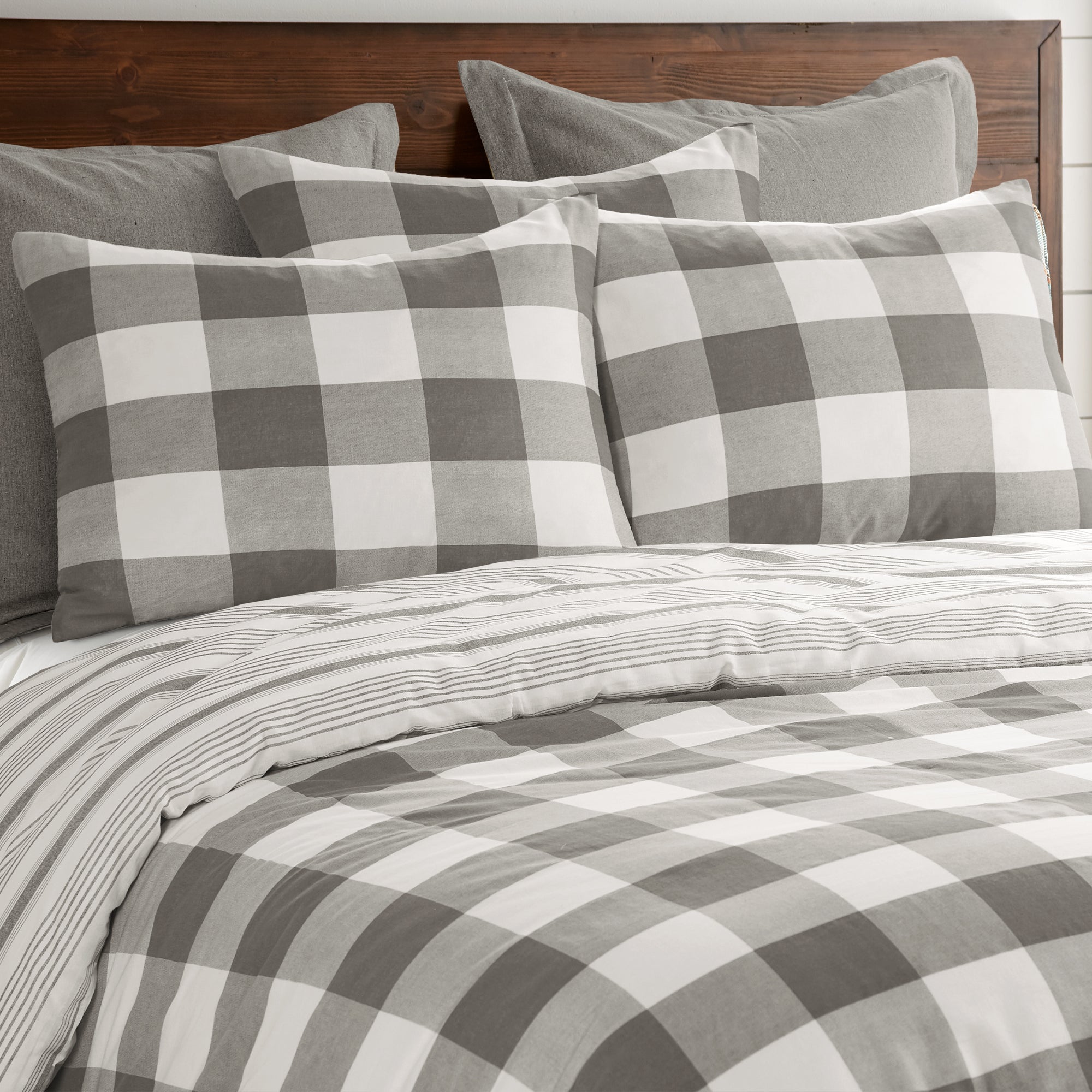 Camden Comforter Set featuring buffalo check pattern with coordinating striped pillowcases.