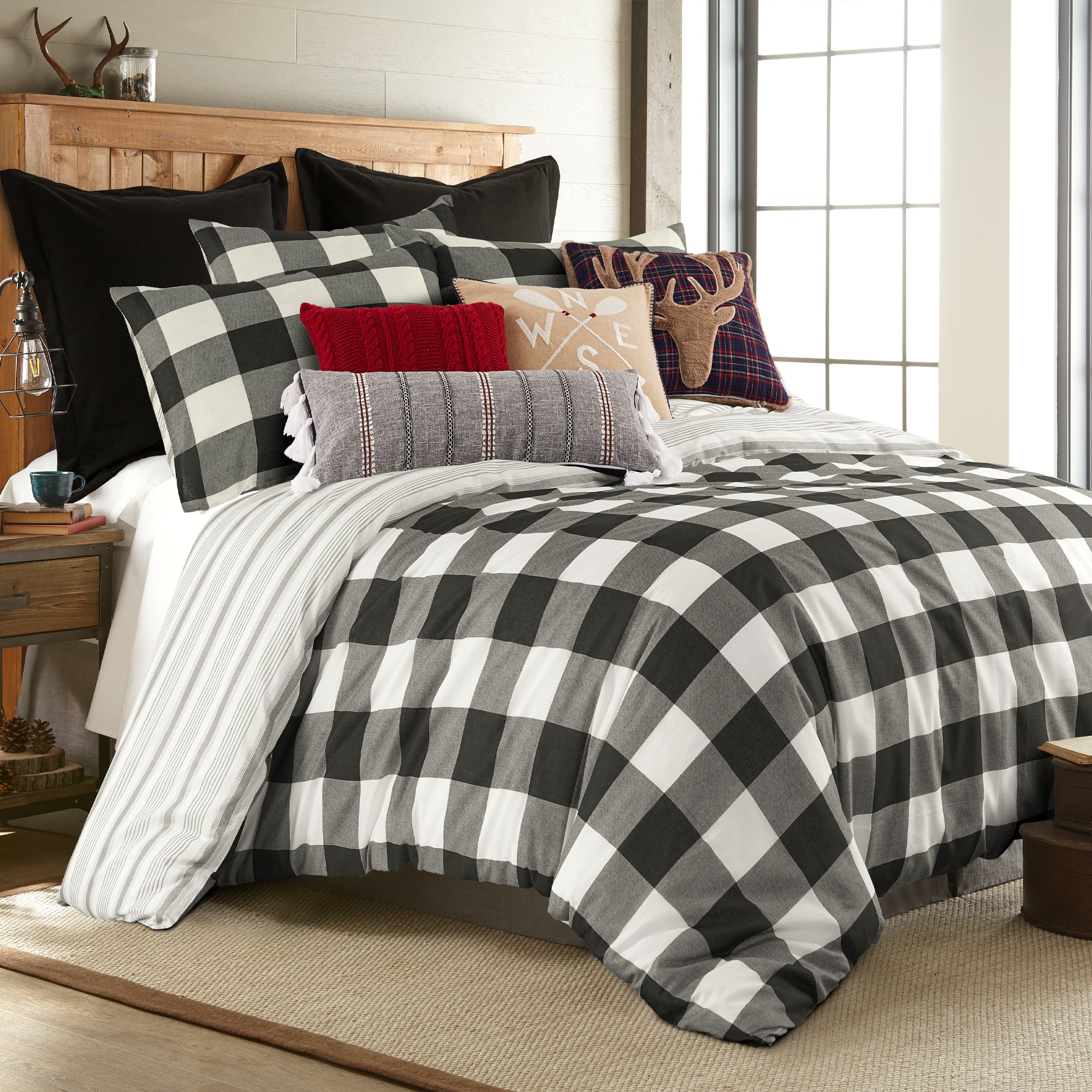 Camden Comforter Set featuring a reversible comforter with buffalo check design and coordinating pillows in a stylish bedroom setting.