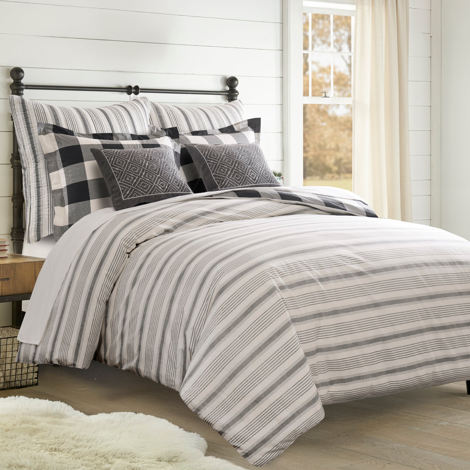 Camden Comforter Set featuring a reversible comforter in buffalo check and stripes, ideal for a stylish bedroom decor.