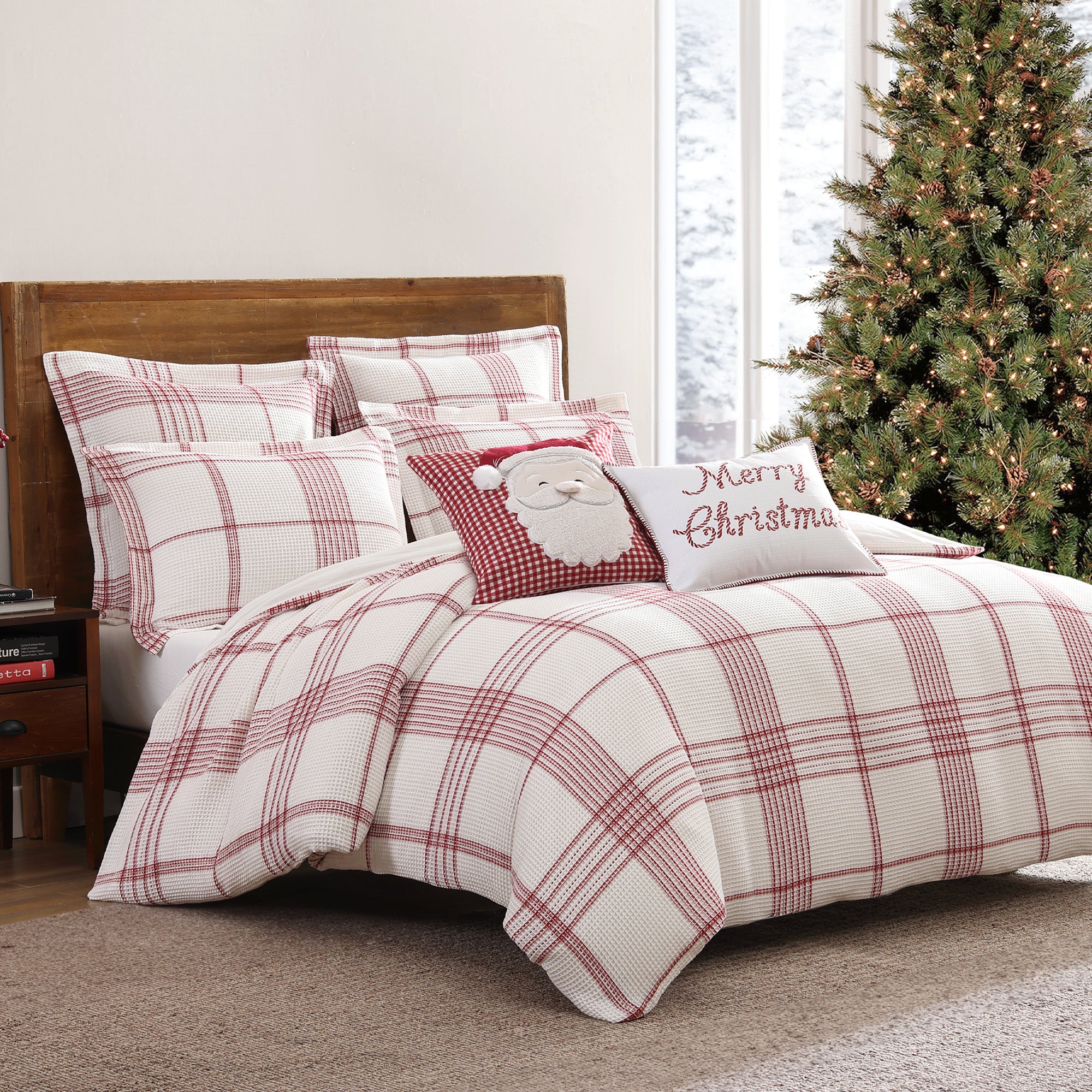 Red and white plaid Christmas duvet cover set with matching shams, styled with festive holiday pillows featuring Santa and “Merry Christmas” text beside a decorated Christmas tree.