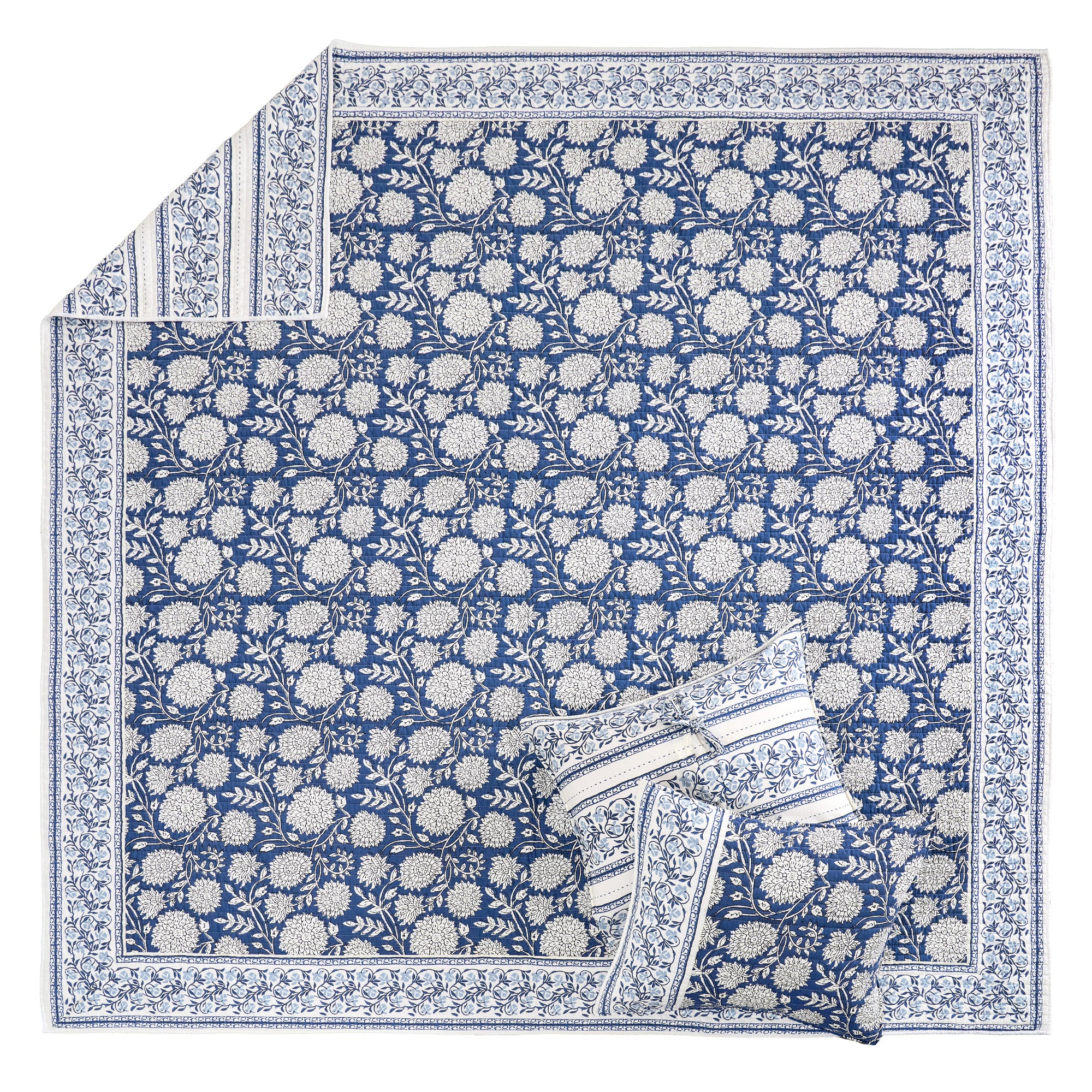 Adare Denim Quilt Set featuring reversible quilt design in blue batik floral print and soft cotton fabric.