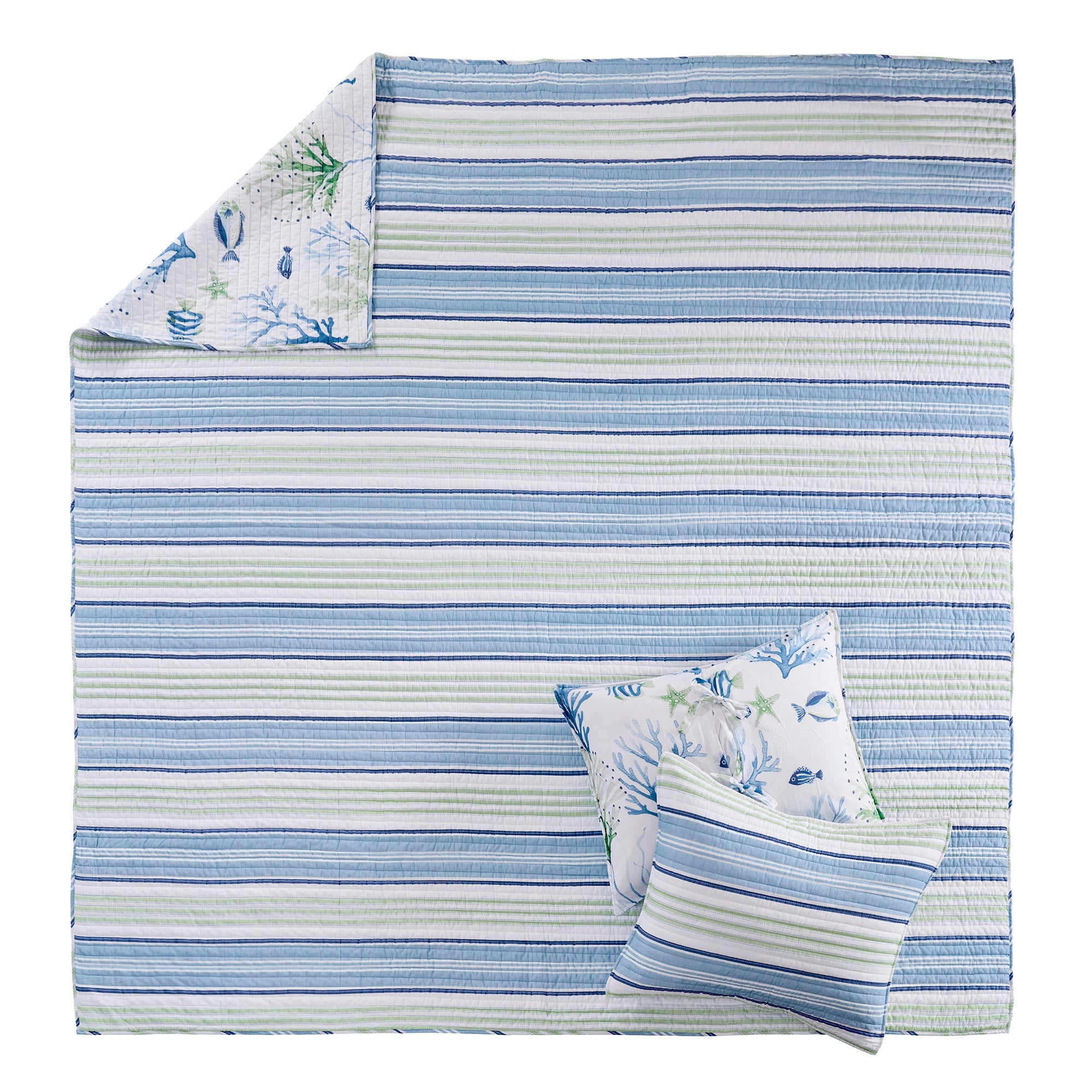 Striped blue and green blanket with a pillow featuring fish designs on a white background