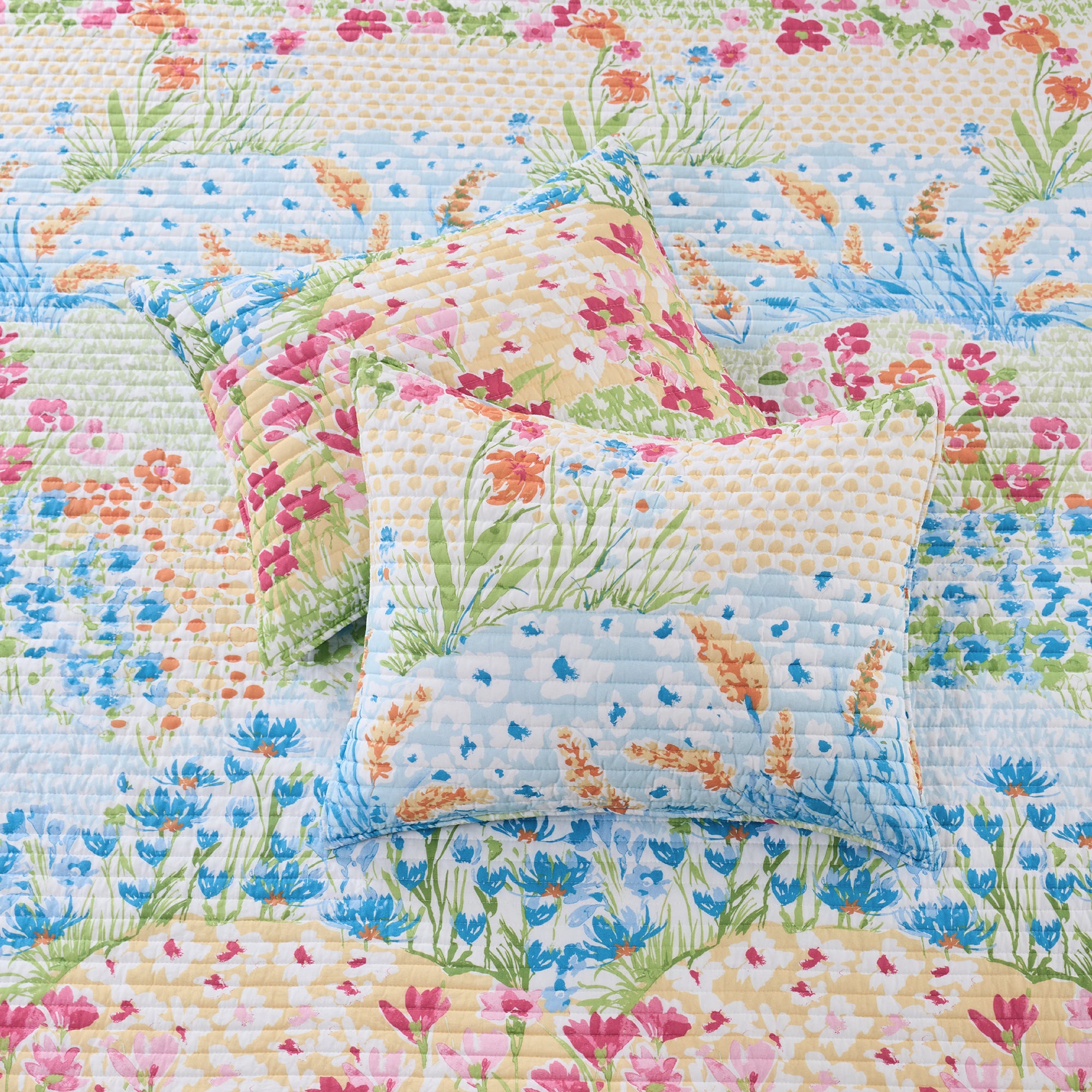 Floral quilt with matching pillow on a floral background