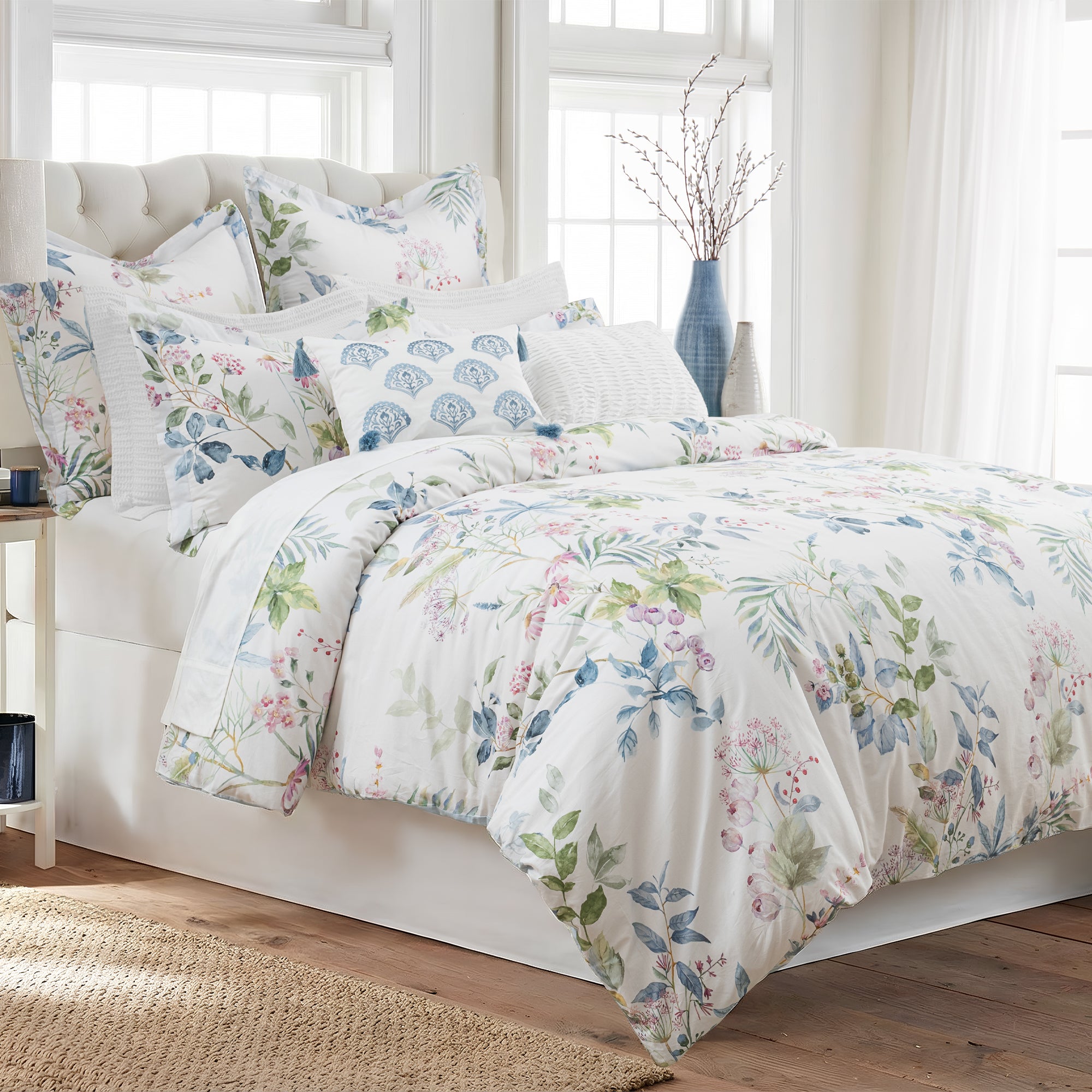Seraphine Blooms Comforter Set displayed on a bed, featuring a floral design on smooth cotton sateen.