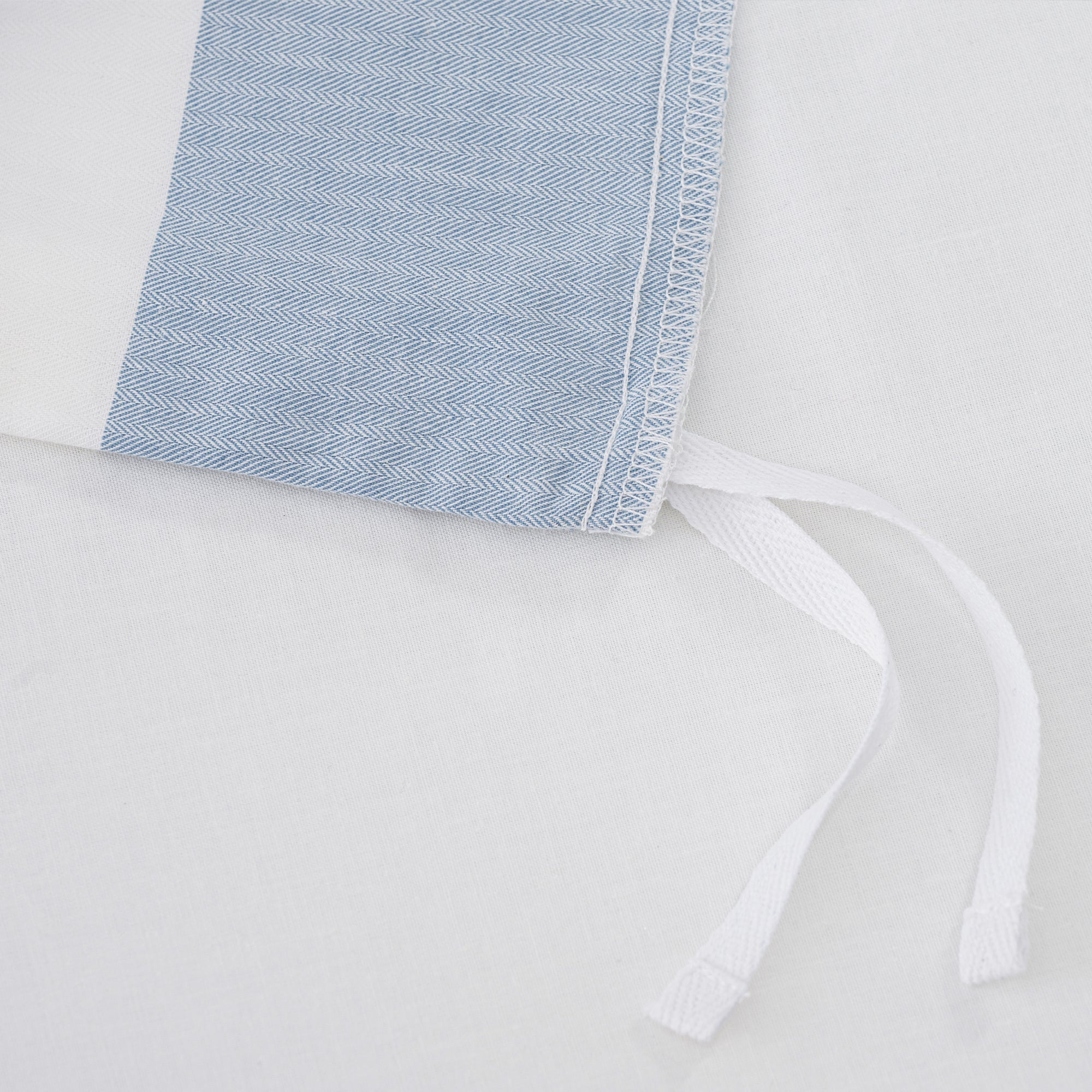 Cabana Woven Stripe Duvet Cover Set showing close-up of the soft coastal blue striped fabric and white detailing.