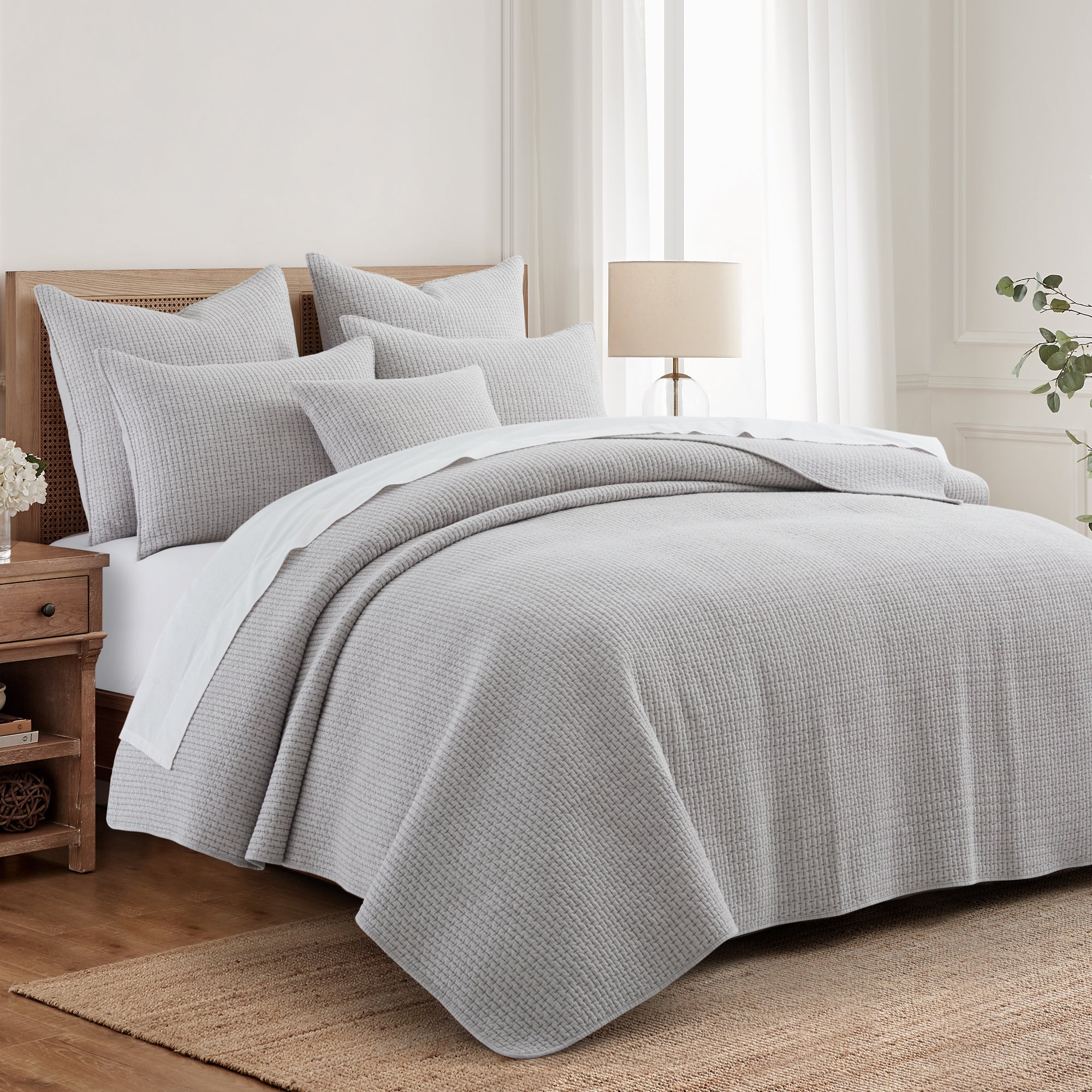 Pick-Stitch Artisan Euro Sham Set of 2 displayed on a cozy bed with matching bedding and soft lighting.