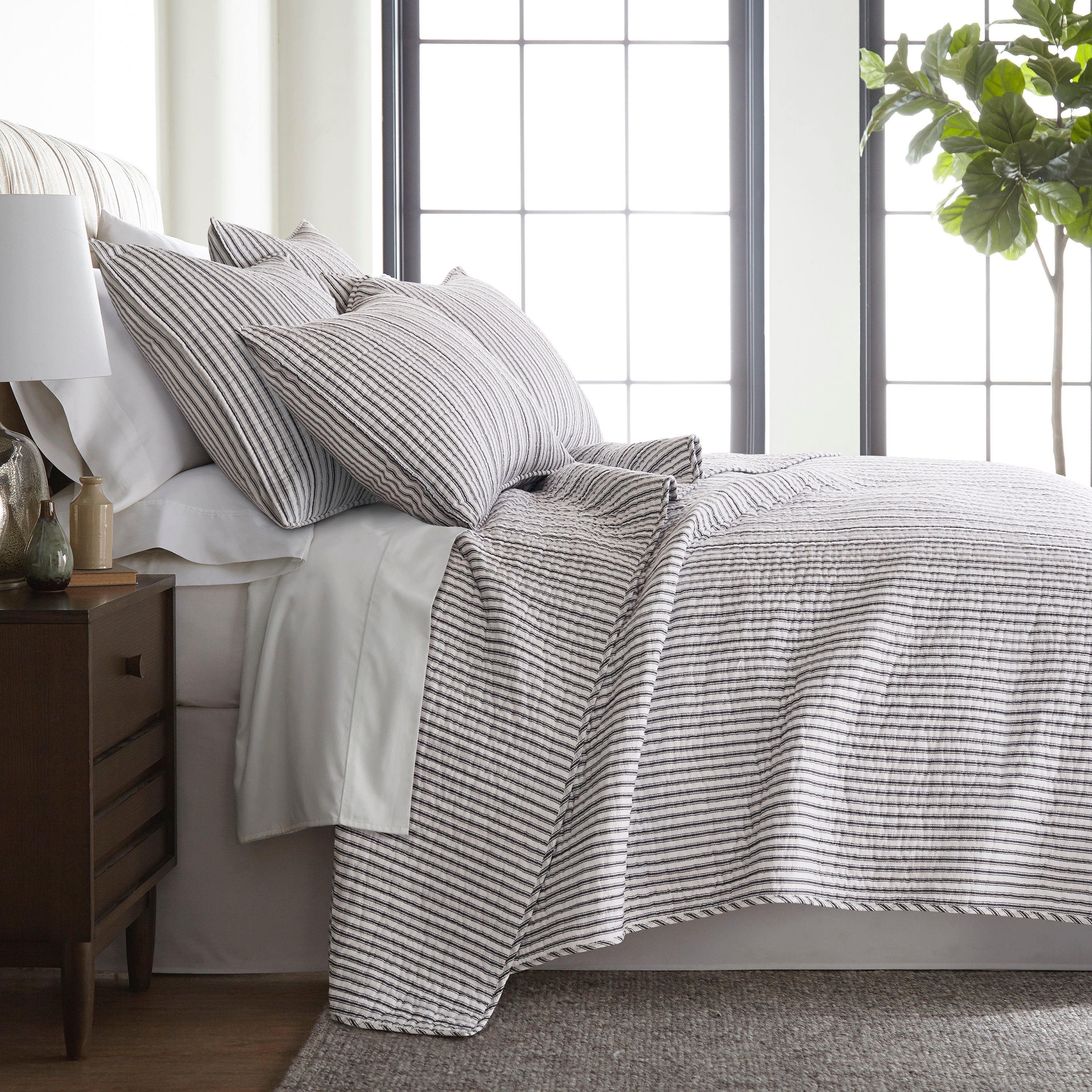 Bed featuring striped bedding set