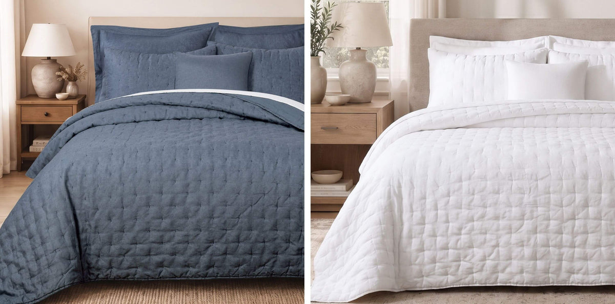 A side-by-side comparison of two quilted bedding sets: a slate blue set on the left and a white set on the right, each styled in a warm, neutral bedroom setting with wooden nightstands and lamps.