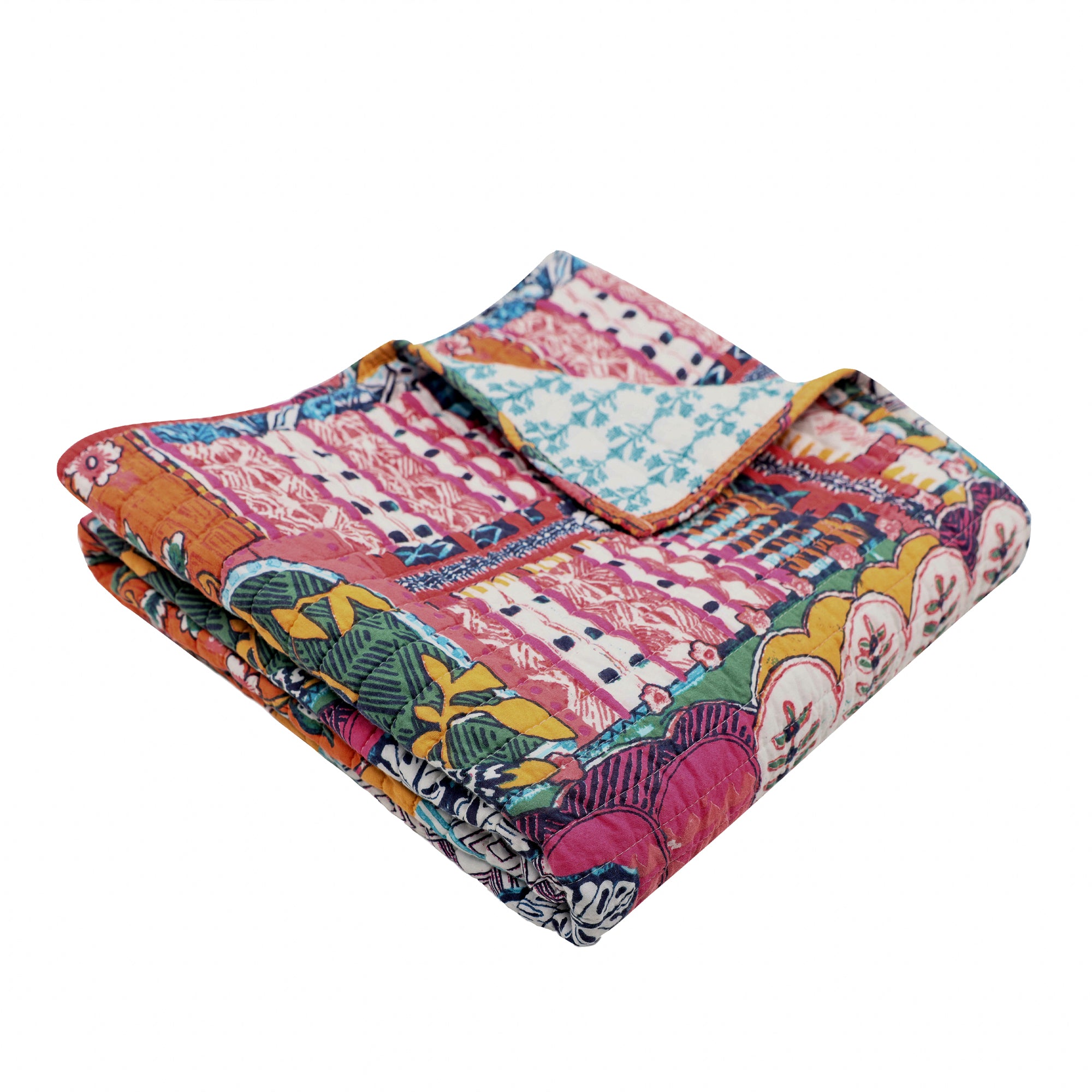 Roshita Quilted Throw featuring a vibrant patchwork design and botanical print, perfect for adding boho style to any space.