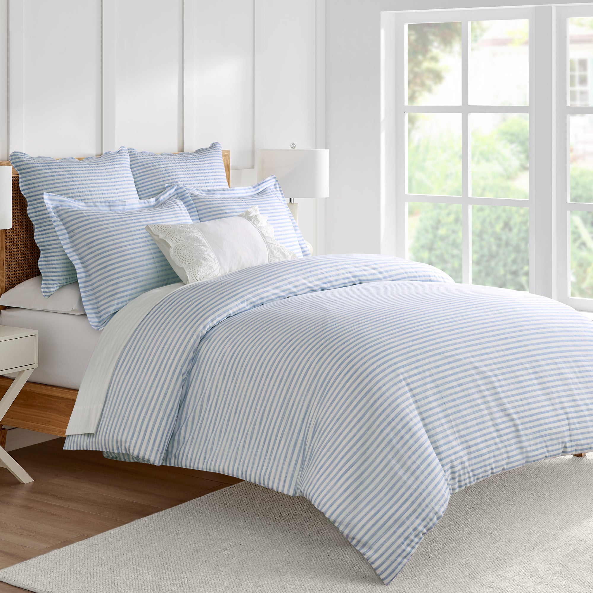 Martha Stripe Blue Duvet Cover Set displayed on a bed with blue and white stripes, perfect for farmhouse charm.