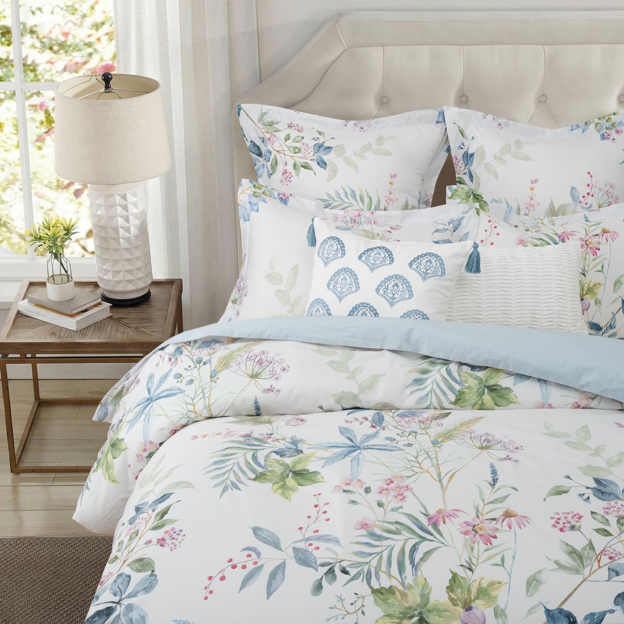 Seraphine Blooms Duvet Cover Set featuring a floral design on smooth cotton sateen in an elegant bedroom setting.