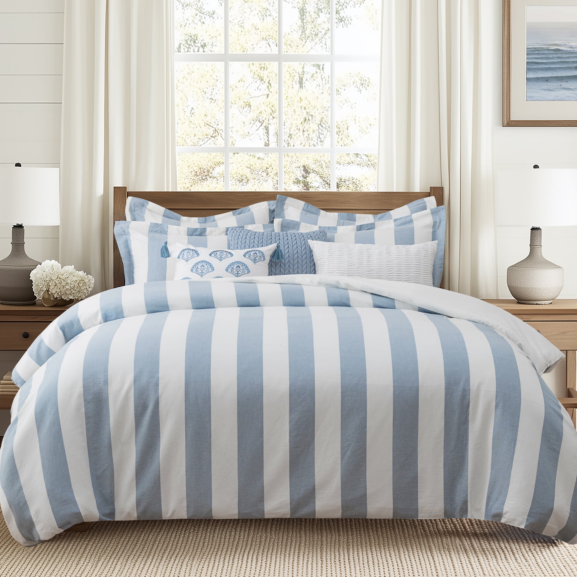 Cabana Woven Stripe Duvet Cover Set with bold blue and white stripes, featuring plush pillows and a coastal aesthetic.