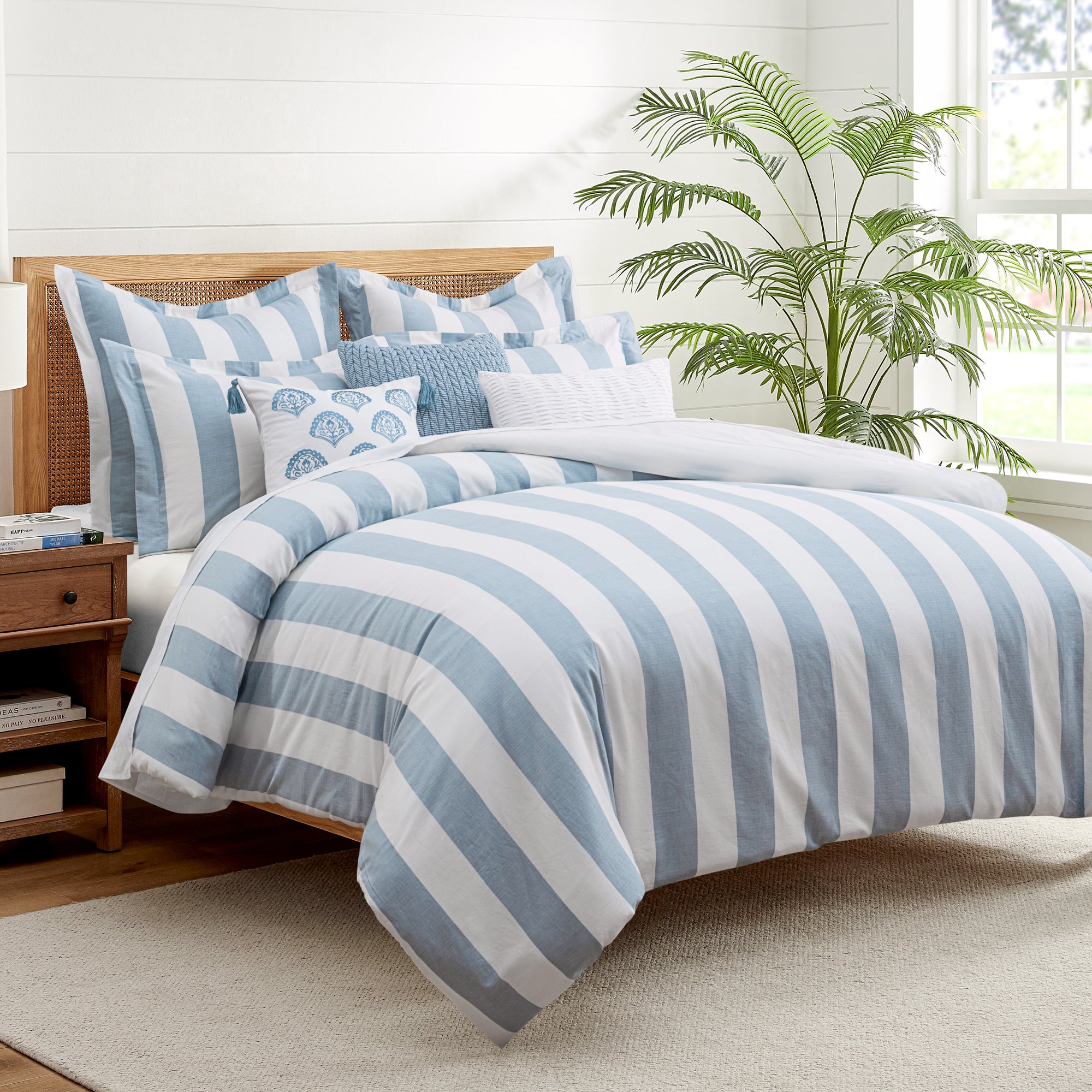 Cabana Woven Stripe Duvet Cover Set featuring coastal blue and white stripes on a bed with decorative pillows.