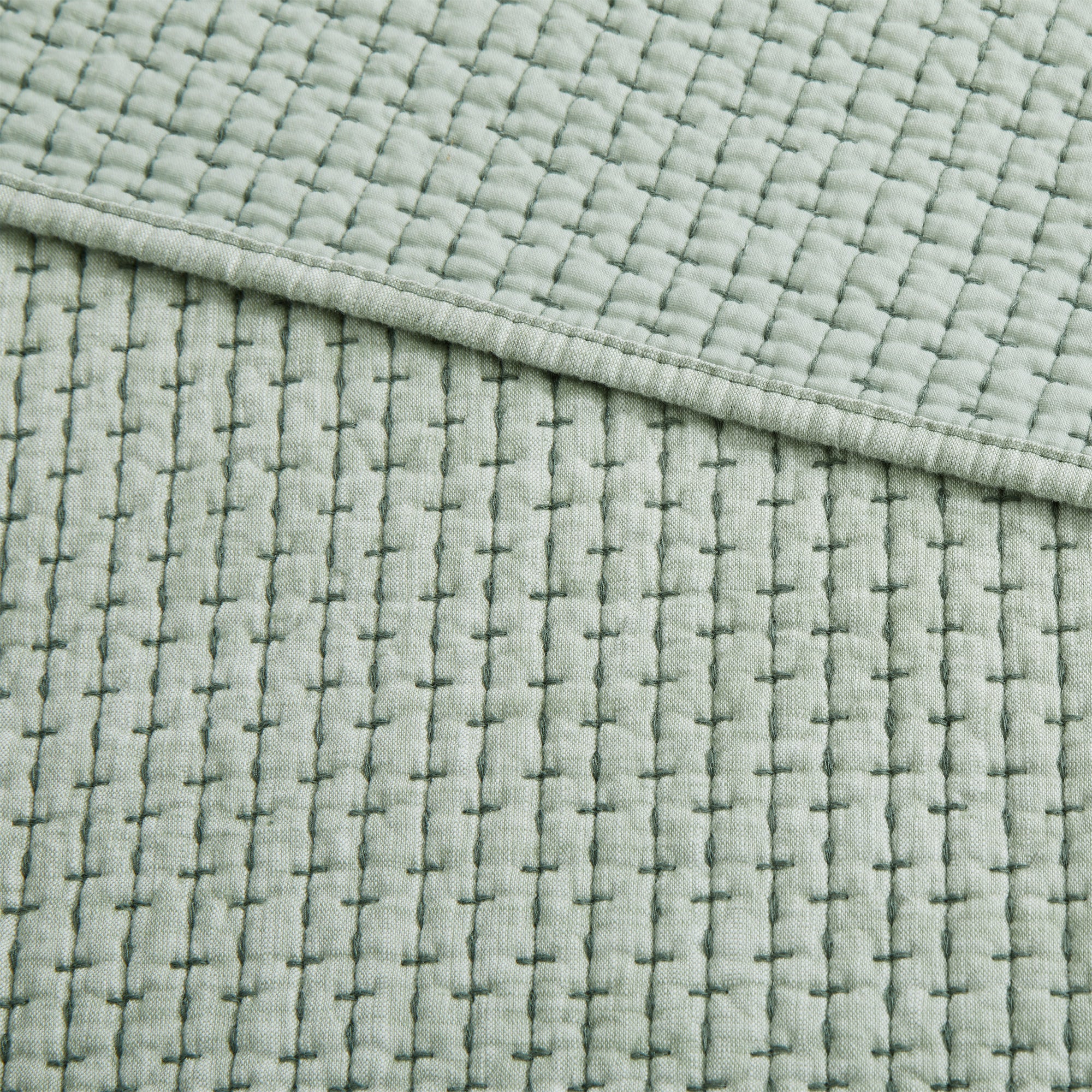 Pick-Stitch Artisan Quilted Throw featuring a textured, quilted cotton slub surface with soft pick-stitch detailing.