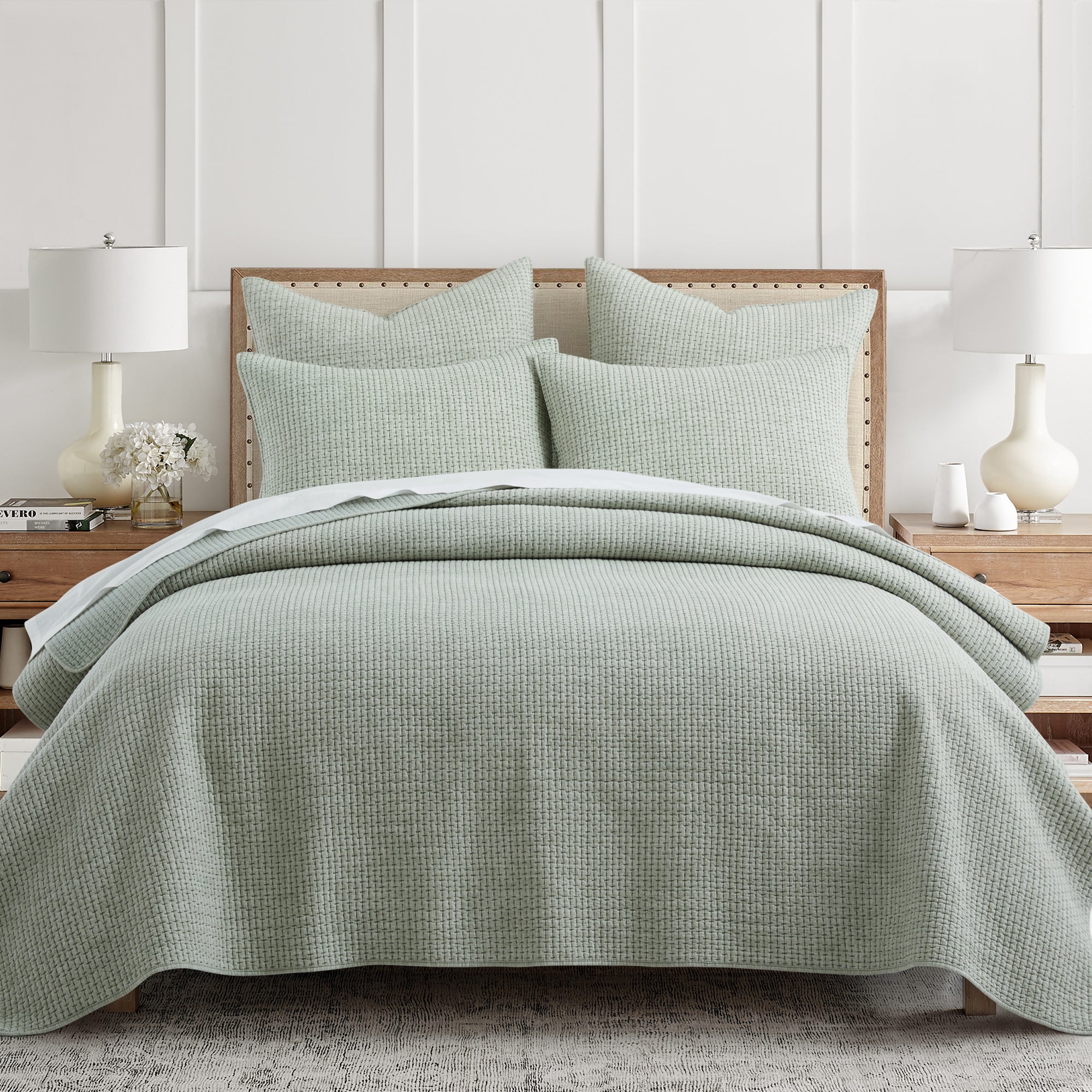 Pick-Stitch Artisan Euro Sham Set of 2 in soft green cotton slub fabric styled on a bed with matching decorative pillows.