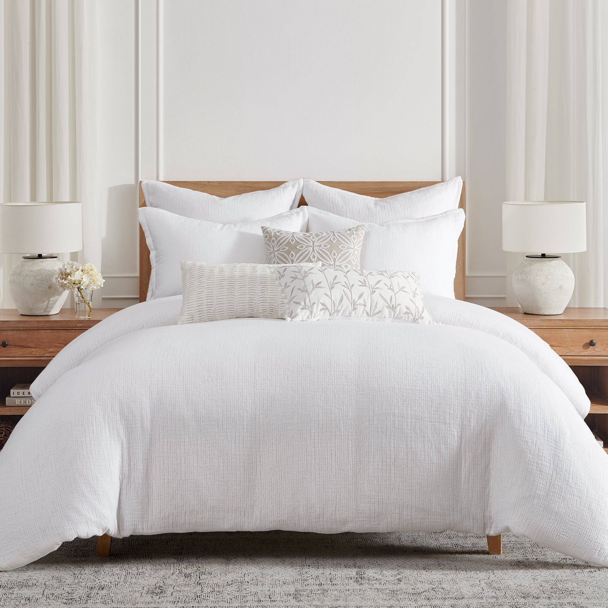 Cotton Tencel Matelasse Comforter Set displayed on a bed with decorative pillows in a modern bedroom setting.