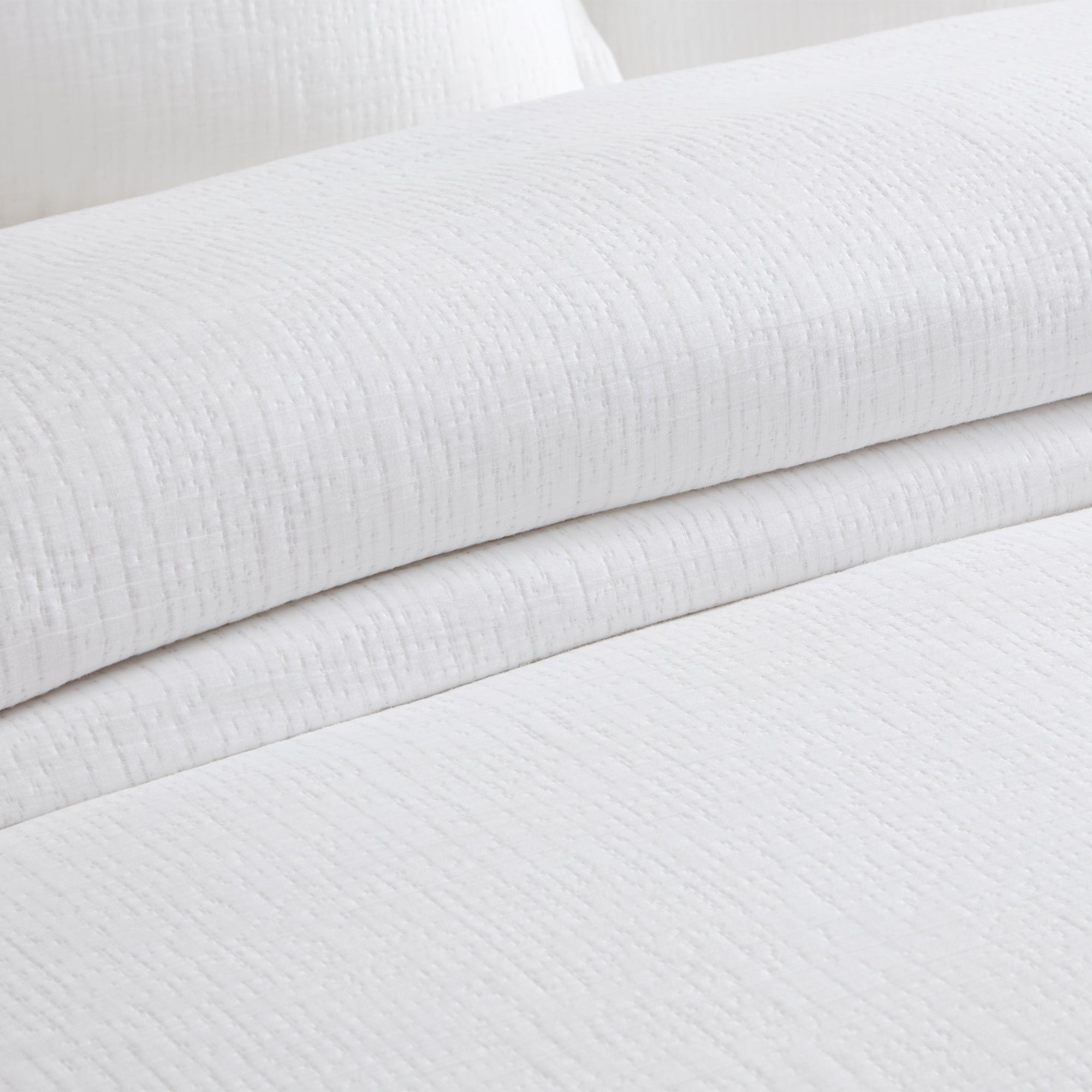 Cotton Tencel Matelasse Comforter Set with a softly textured solid design in crisp white, showcasing the comforter and pillow shams.