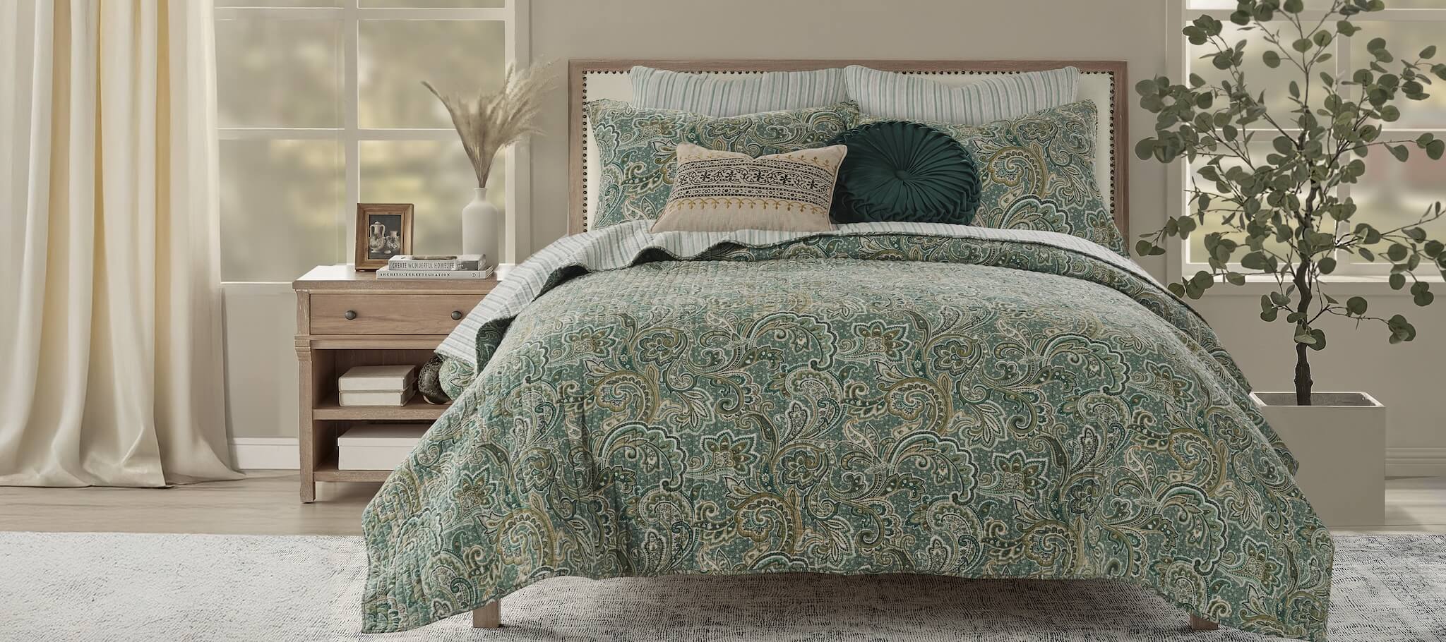 Levtex Home Kimpton Quilt Set in Green featuring a paisley pattern with matching bedding accents