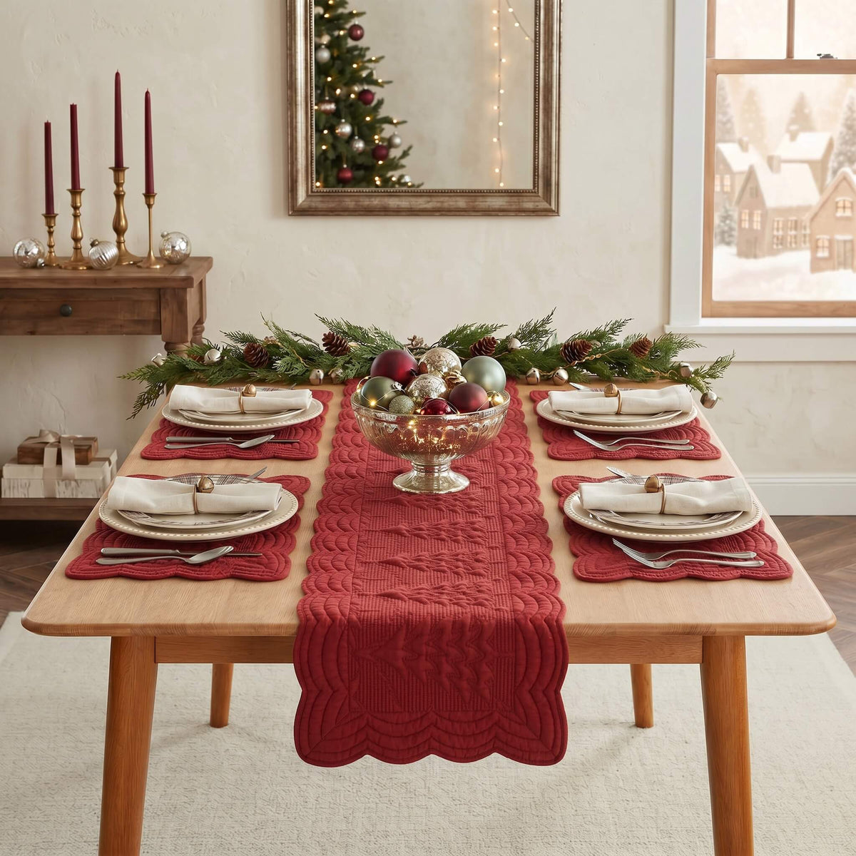A festive holiday table setting featuring a textured red knit table runner down the center of a light wood dining table