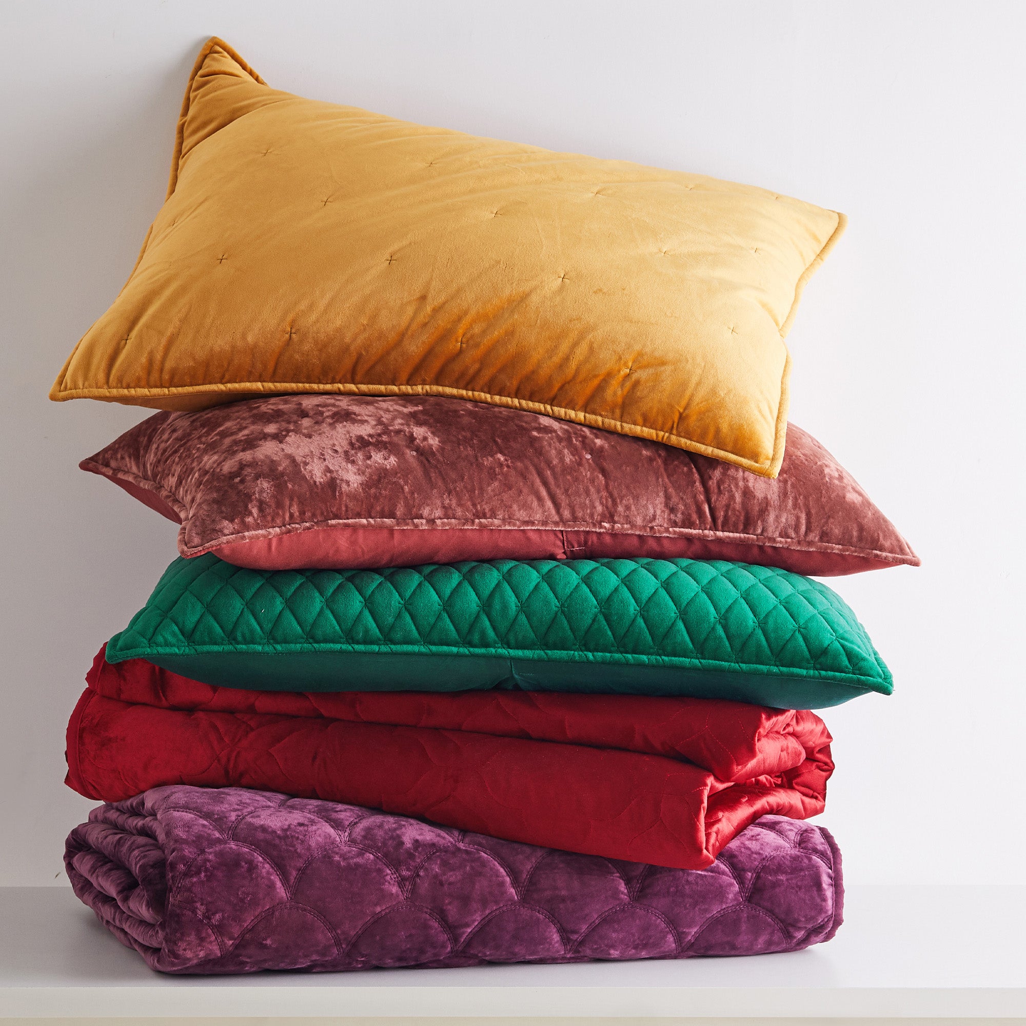 Stack of the velvet bedding in different colors